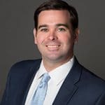 Headshot of Andrew Emmett.