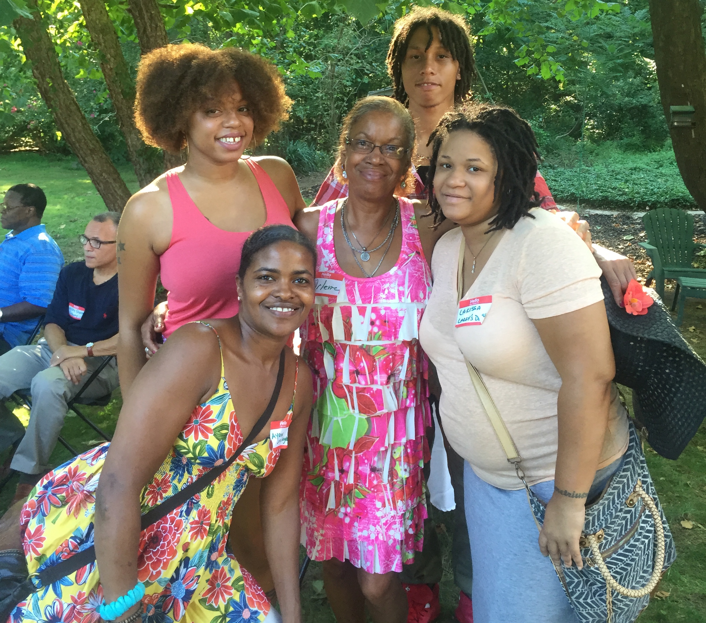 Arlene posing with four family members.