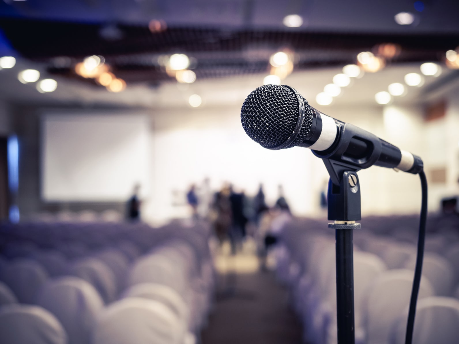 Microphone in front of empty chairs.