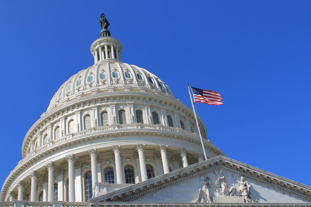 United States Capitol Building with American flag.