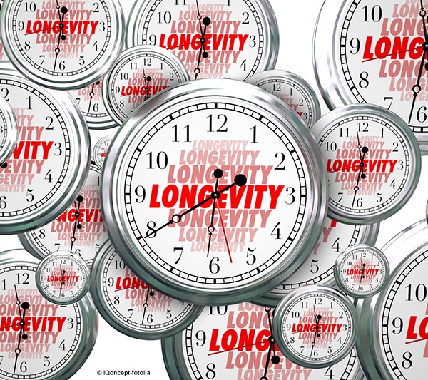 Many analog clocks with repeating text "longevity."