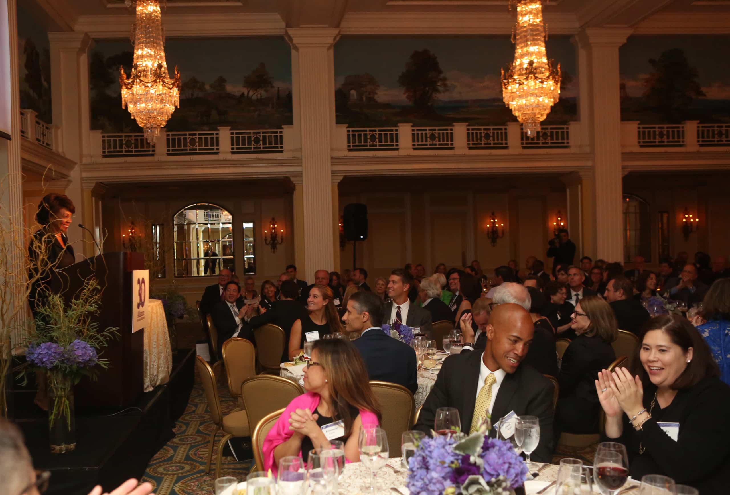 Full tables at gala dinner.