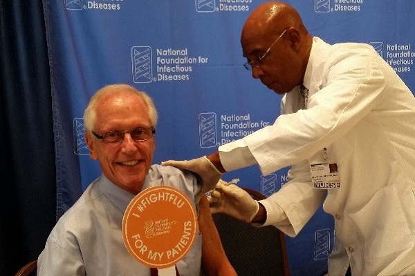 Dr. William Schaffner receiving a flu shot.
