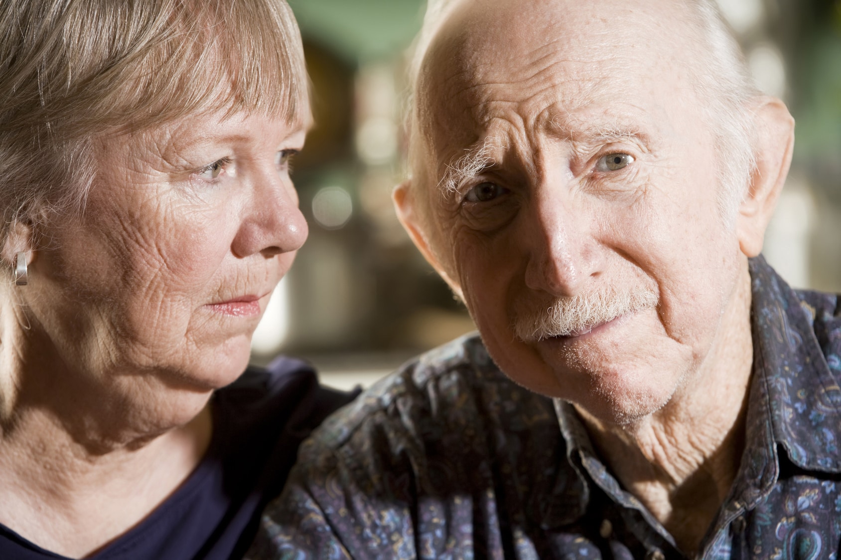Concerned elderly couple.