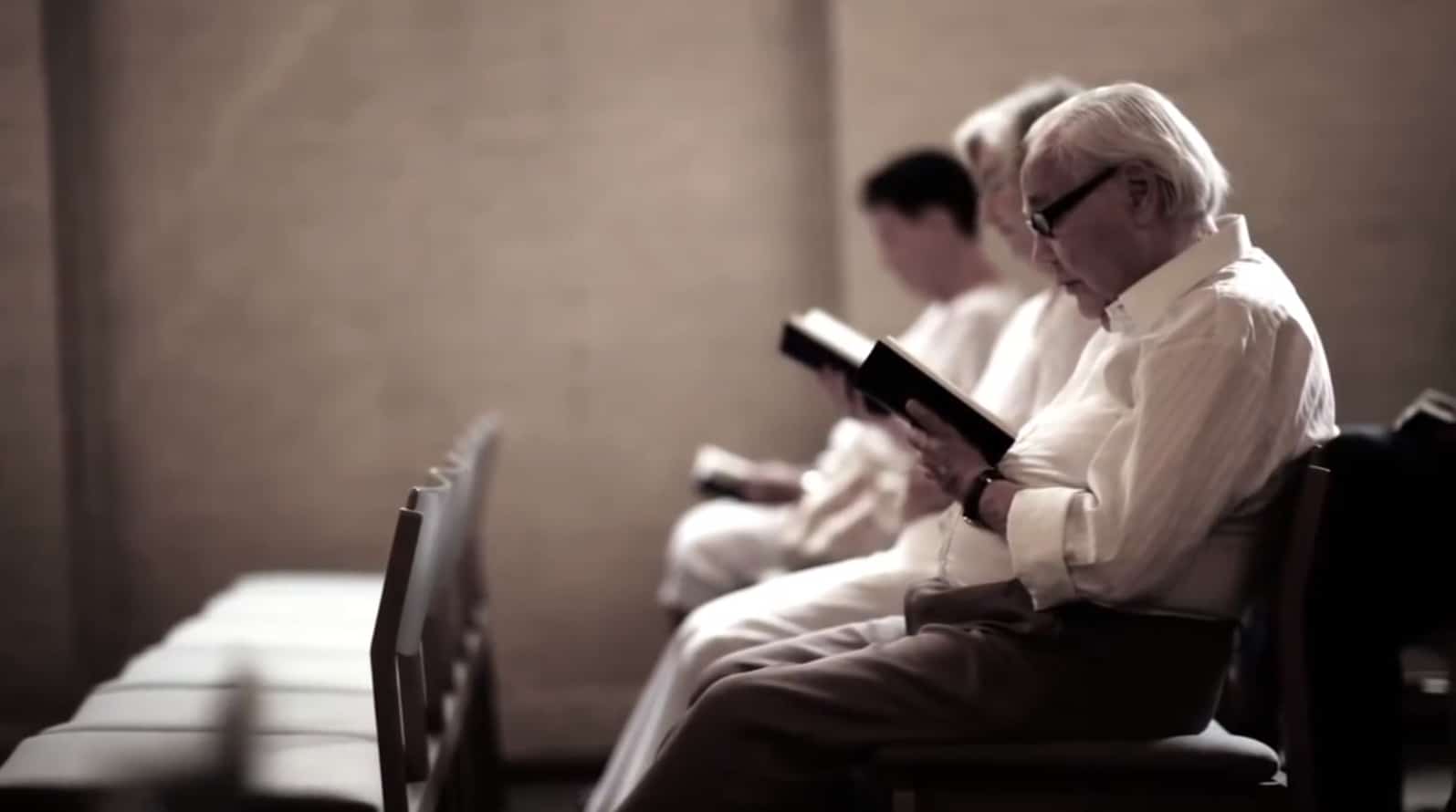 Row of seniors sitting and reading.