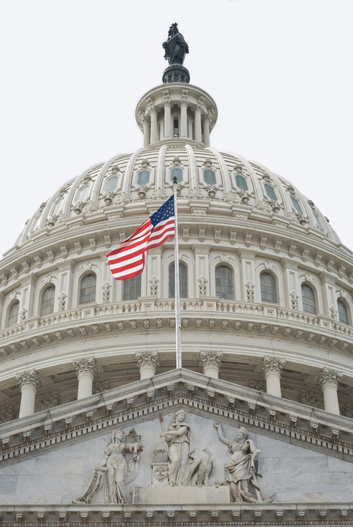 United States Capitol Building with American flag.