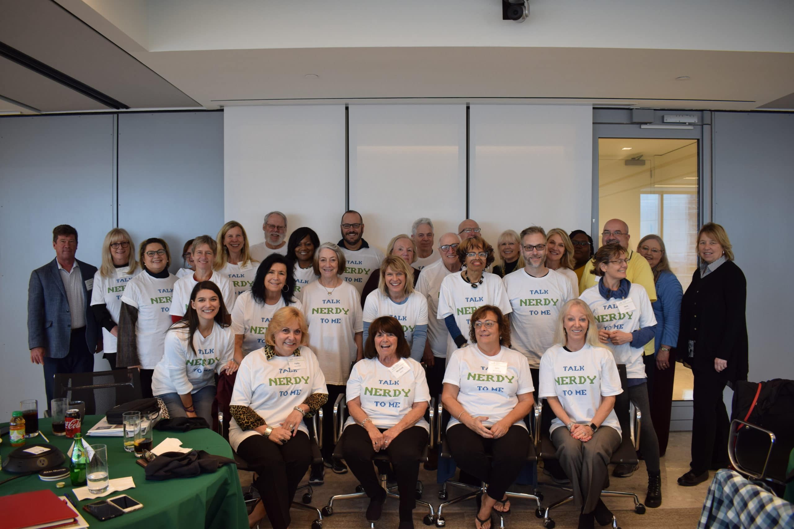 Large group of training participants wearing Talk Nerdy to Me t-shirts.