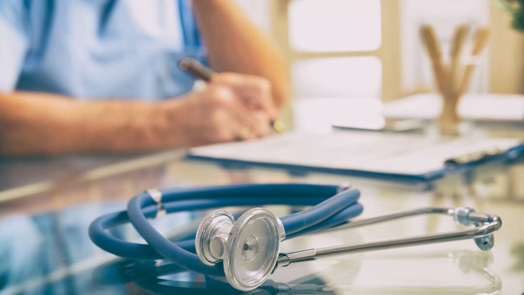 Stethoscope laying on table.