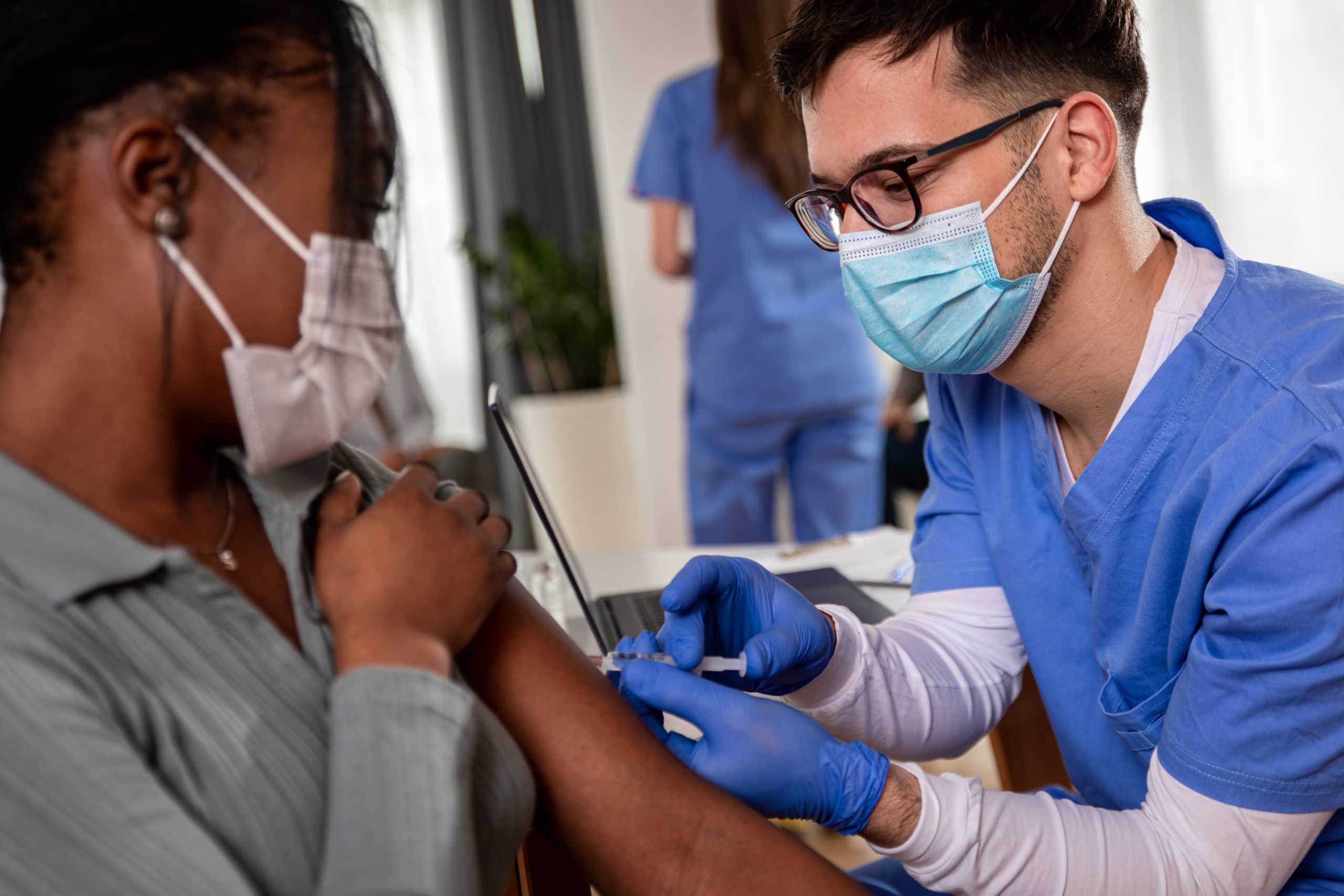 Nurse administering a vaccine.