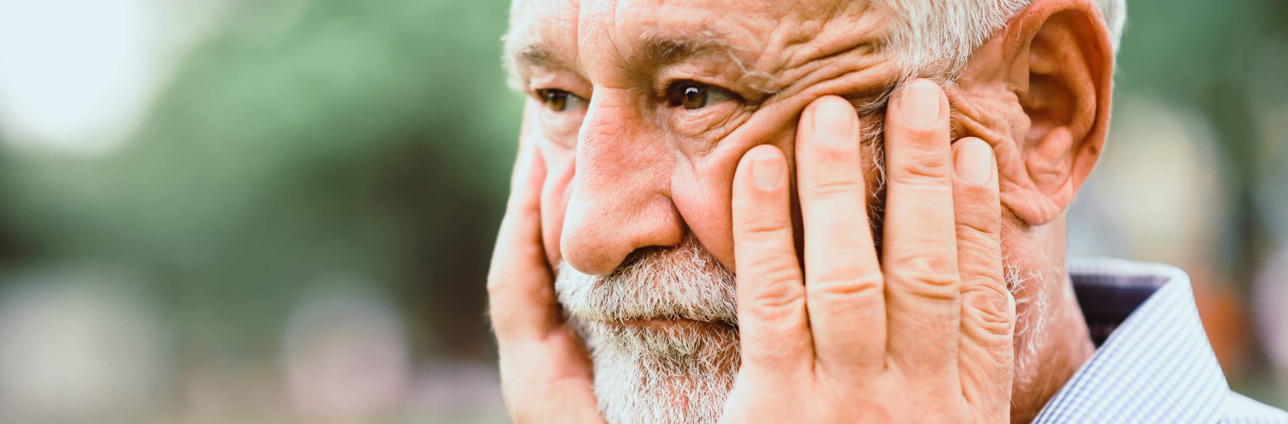 Elderly man looking concerned.