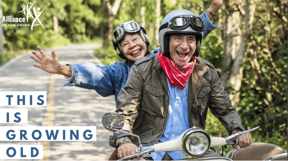 Cover image for This is Growing Old podcast with two happy seniors riding a moped.