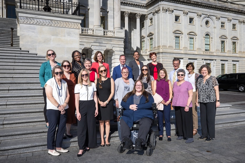 PCORI staff and invited researchers pose in front of the U.S. Capitol building in Washington, D.C. following the PCORI Annual Meeting held Oct. 4-5, 2023.