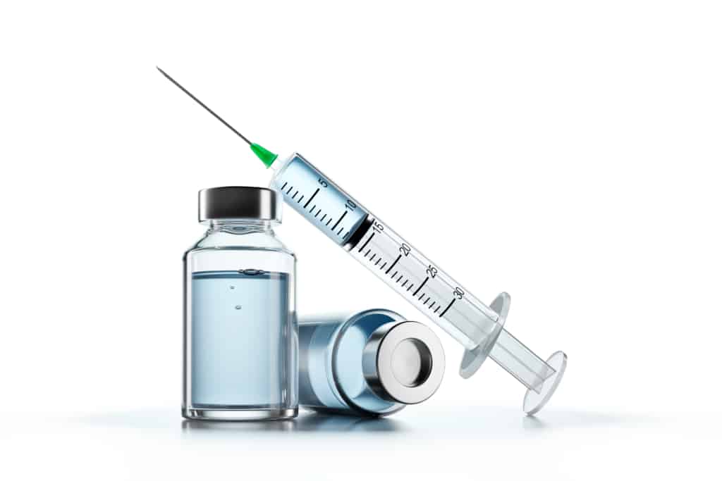 Vile with a syringe