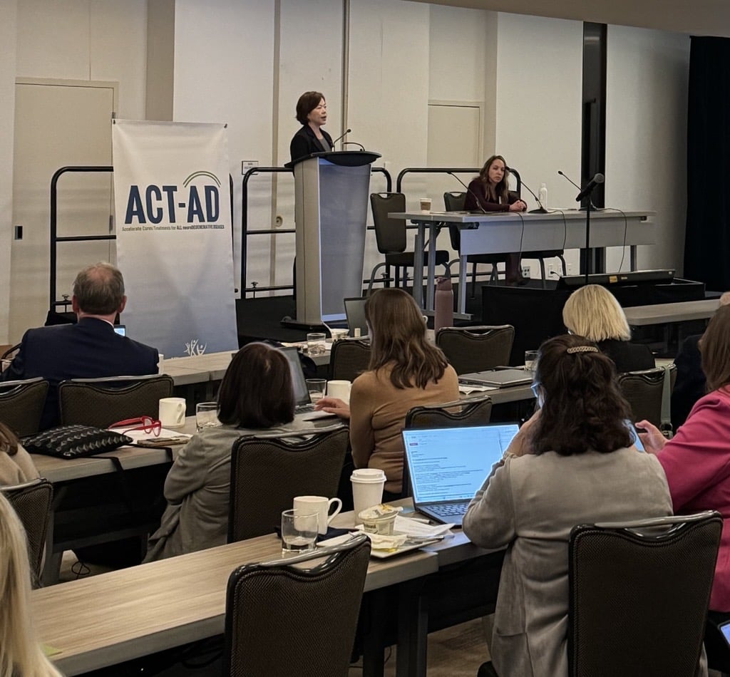 Jin Zhou, M.D., Ph.D., and Carrie Rubel, Ph.D. on stage