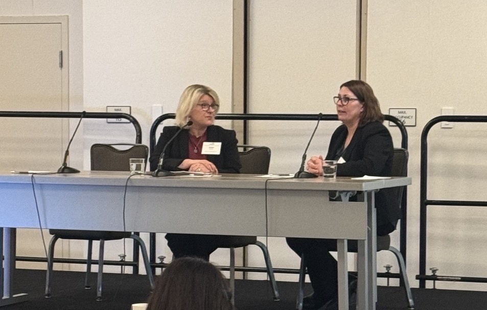 Sue Peschin, MHS, and Teresa Buracchio, M.D. on stage