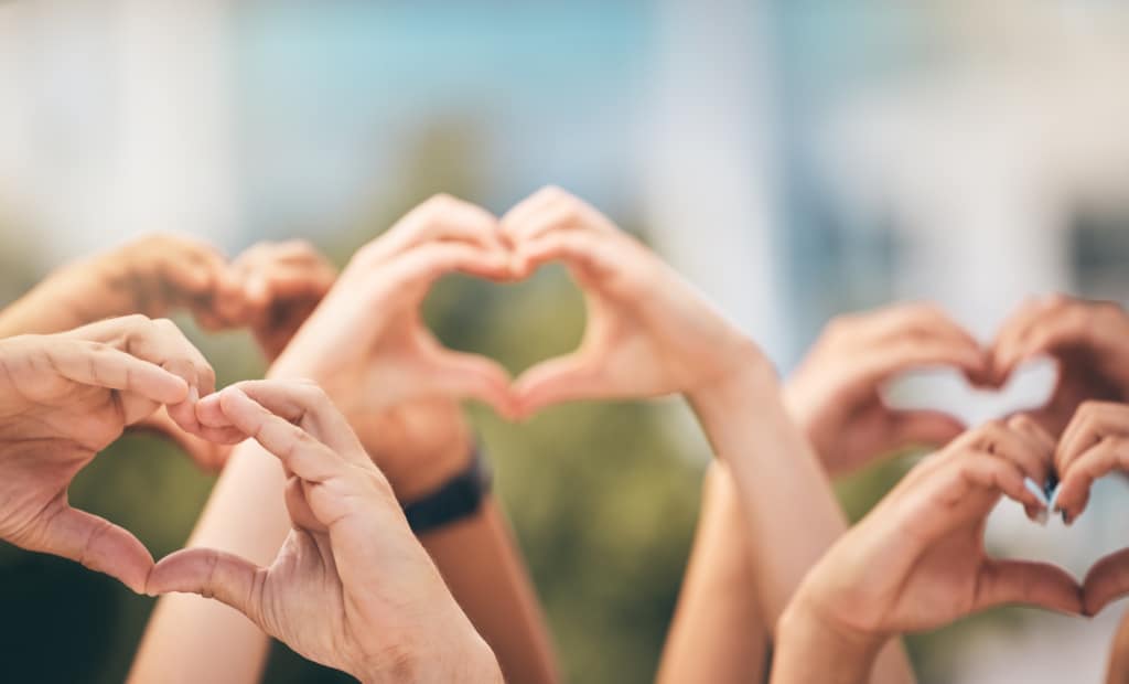 Group of hands shaped like hearts